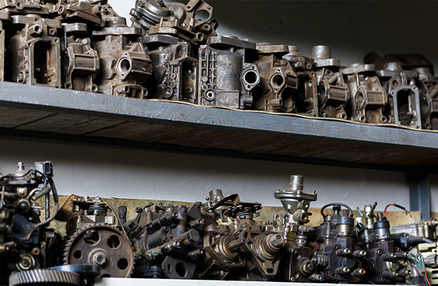 Engine parts on metal shelves